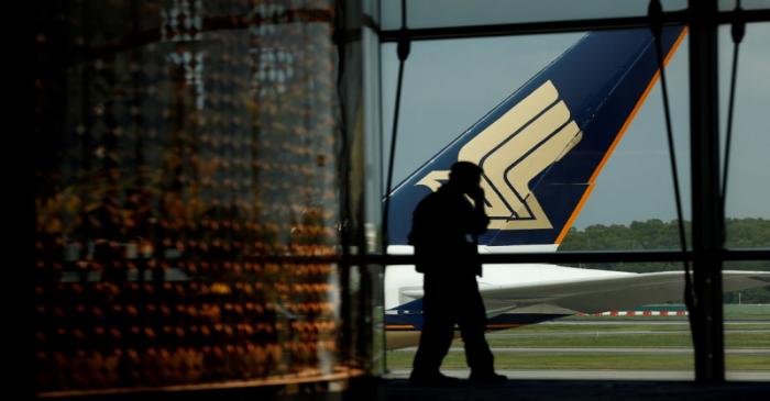 FILE PHOTO: A Singapore Airlines plane sits on the tarmac at Singapore's Changi Airport