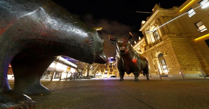 Bull and bear symbols for successful and bad trading are seen in front of the German stock