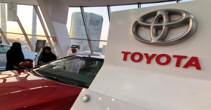 Customers look at 2019 Camry Hybrid in Toyota dealer in Dhahran, Saudi Arabia
