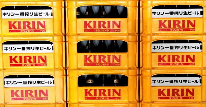 FILE PHOTO: Plastic cartons containing Kirin brand beer bottles are seen at Kirin Brewery Co.