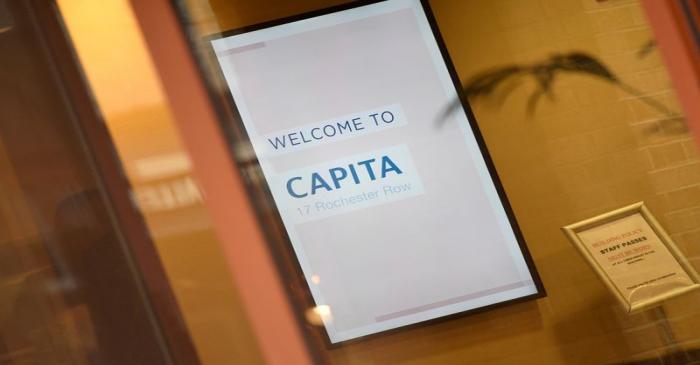 FILE PHOTO: An illuminated sign is seen in Capita offices in London