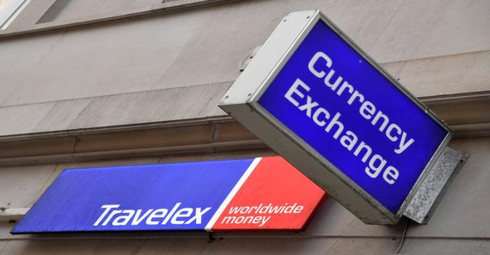 FILE PHOTO: Signage is seen on a branch of Travelex Currency Exchange in London