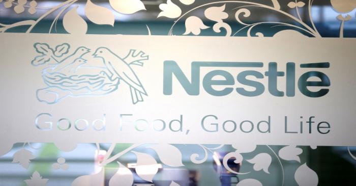 FILE PHOTO: Nestle logo is pictured on the door of the supermarket of Nestle headquarters in