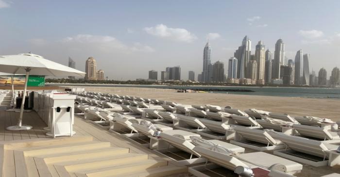 Empty sun-decks are seen at a beach, after a curfew was imposed to prevent the spread of the