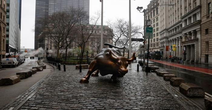 FILE PHOTO: The Wall St. Bull is seen standing on a nearly empty Broadway in the financial