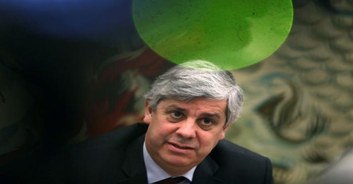 FILE PHOTO: Portugal's Finance Minister and Eurogroup President Mario Centeno looks on during