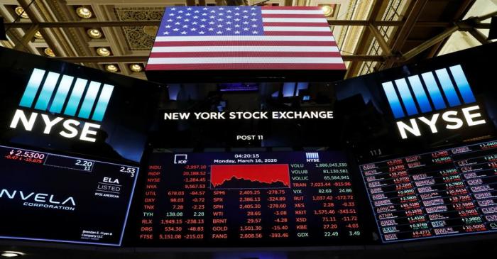 Traders work on the floor of the New York Stock Exchange shortly as coronavirus disease