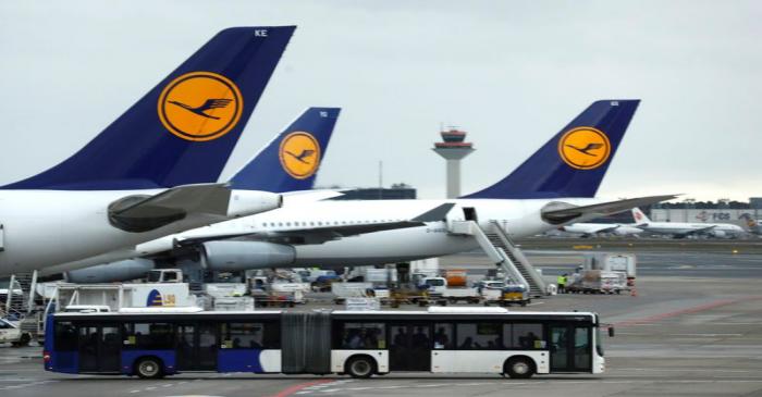 FILE PHOTO: Airplanes of German carrier Lufthansa stand at the air terminal of Frankfurt