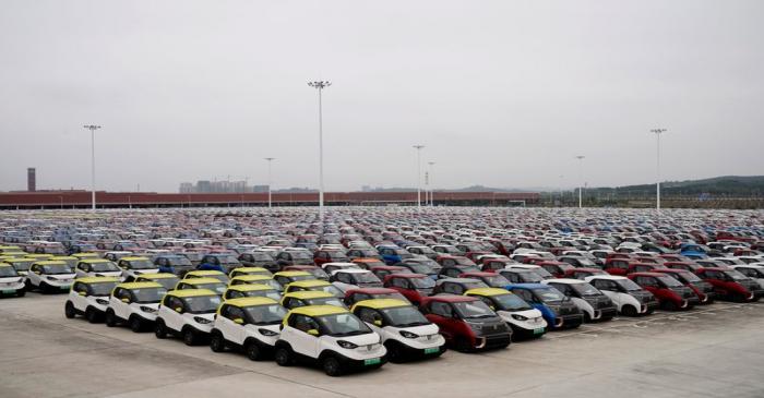 FILE PHOTO: Baojun E100 and E200 all-electric battery cars sit parked at a parking lot operated