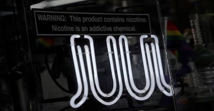 Signage for Juul vaping products is seen on a storefront in New York City