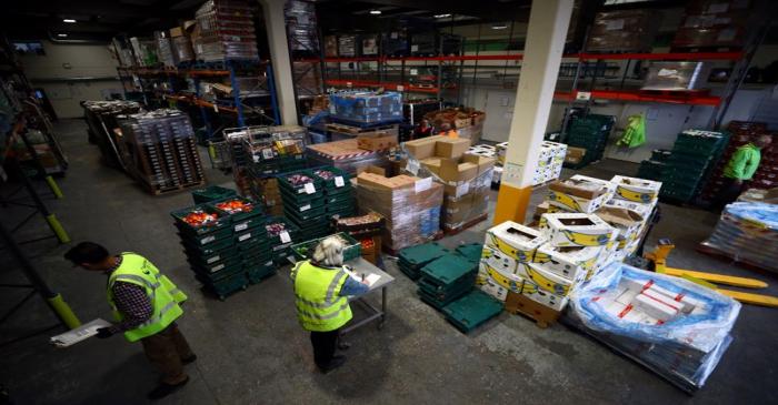 Volunteers sort and check food quality at the FareShare food redistribution centre in Deptford,