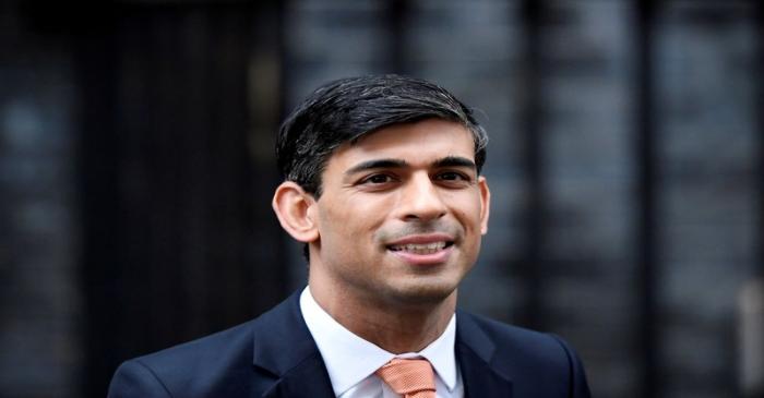 FILE PHOTO: Newly appointed Britain's Chancellor of the Exchequer Rishi Sunak leaves Downing
