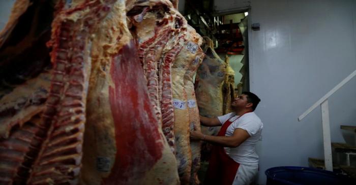 A butcher stores cattle carcasse in a butcher shop during the coronavirus disease (COVID-19),