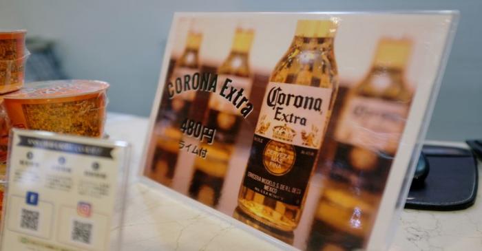 FILE PHOTO: A sign advertising discounted Corona beers is displayed at the front desk of the