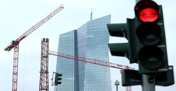 Specialists work on a crane in front of the European Central Bank (ECB) in Frankfurt