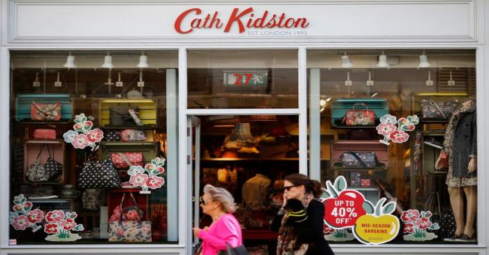 People walk past a Cath Kidston store in London