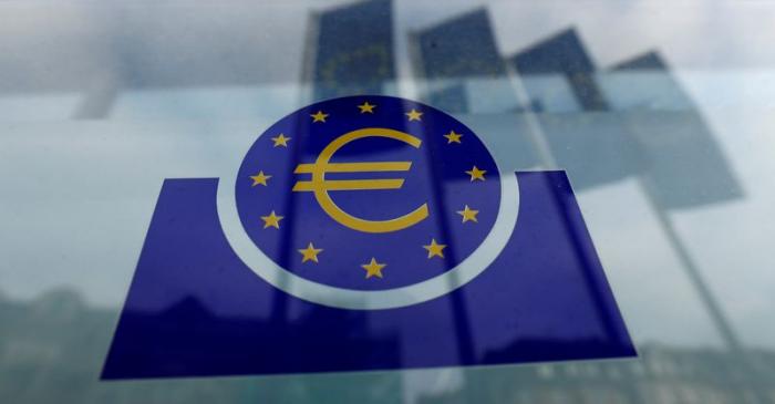 FILE PHOTO: Specialists work on a crane in front of the European Central Bank (ECB) in