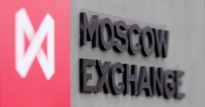 FILE PHOTO: A board with the logo of the Moscow Exchange is on display in its office in Moscow
