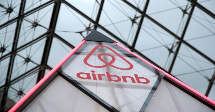 FILE PHOTO: Airbnb logo is seen on a little mini pyramid under the glass Pyramid of the Louvre