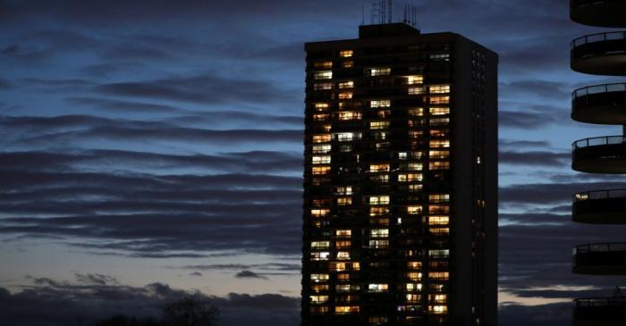 Lights shine from apartments in a residential building during the global outbreak of