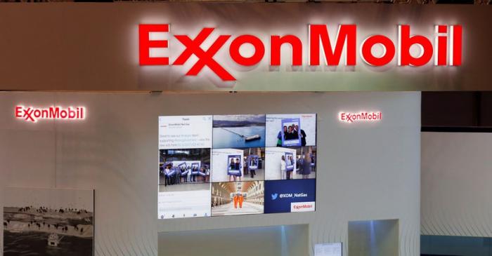 FILE PHOTO: Logos of ExxonMobil are seen in its booth at Gastech, the world's biggest expo for
