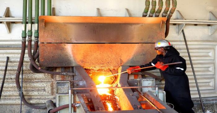 A worker attends to machinery at a smelter plant at Anglo American Platinum's Unki mine in