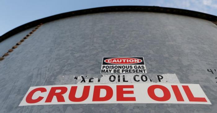 FILE PHOTO: FILE PHOTO: A sticker reads crude oil on the side of a storage tank in the Permian