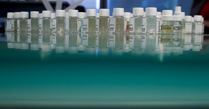 FILE PHOTO: Bottles containing fragrances stand in a laboratory of Givaudan in Paris