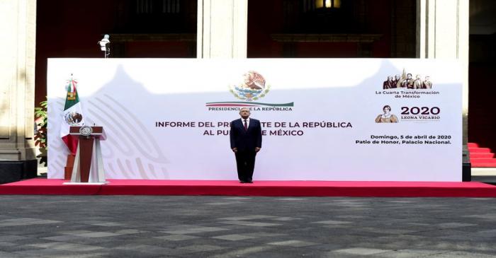 Mexico's President Andres Manuel Lopez Obrador sings the national anthem before the