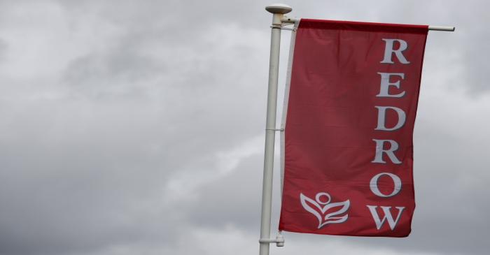 FILE PHOTO: The company logo of construction company Redrow is pictured on a flag at a new