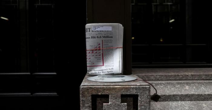 An uncollected Wall Street Journal newspaper on nearly deserted Wall Street during the outbreak