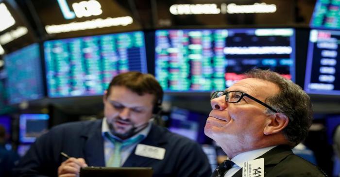 Traders work on the floor of the NYSE in New York