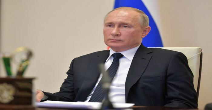 Russian President Putin chairs a meeting via video link outside Moscow