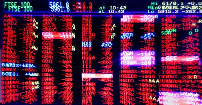 FILE PHOTO: London trading screen shows market slump