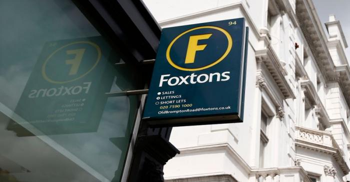 FILE PHOTO: A Foxtons estate agent sign is seen outside a branch in west London
