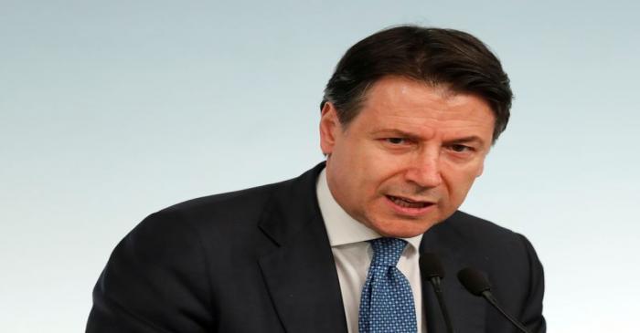 FILE PHOTO: Italian Prime Minister Giuseppe Conte speaks to media as he announces a decree that