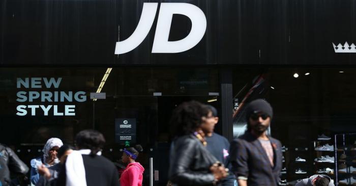 People pass a JD Sports store in London