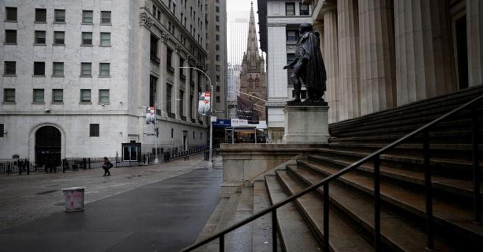 FILE PHOTO: Nearly deserted Wall Street and steps of Federal Hall in lower Manhattan during