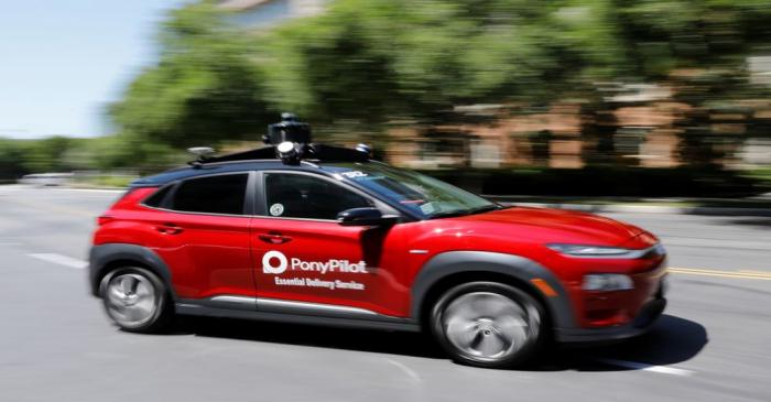 Autonomous electric vehicles deliver packages during the outbreak of the coronavirus disease