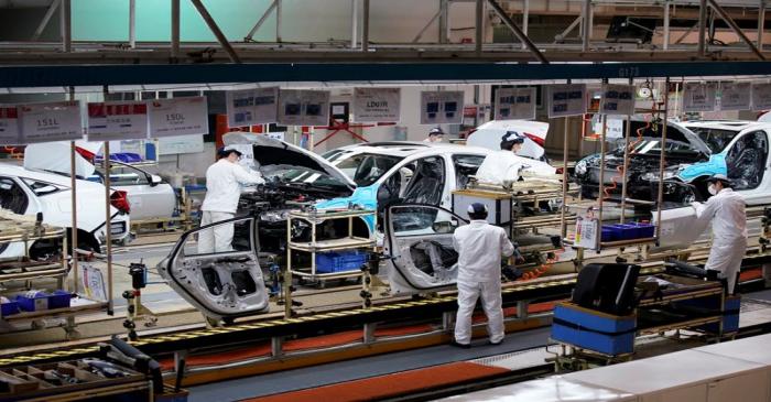 FILE PHOTO: Employees work on a production line inside a Dongfeng Honda factory in Wuhan