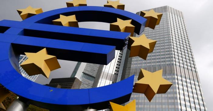 A euro logo sculpture stands in front the headquarters of the European Central Bank  in