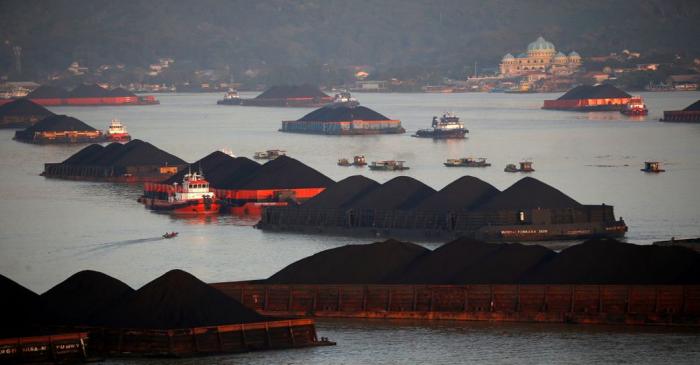 FILE PHOTO: Coal barges are pictured as they queue to be pull along Mahakam river in Samarinda,