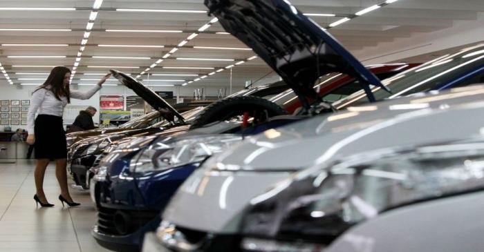 FILE PHOTO: An employee works at a Renault cars sales and show room in Moscow