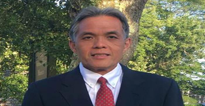 Former RBS employee Victor Hong poses in an undated handout photo