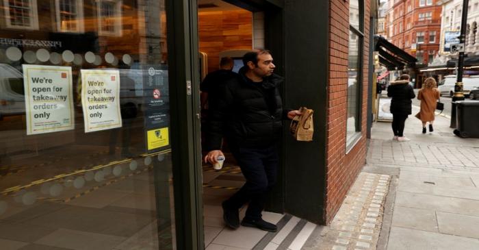 A man leaves a McDonald's restaurant in London