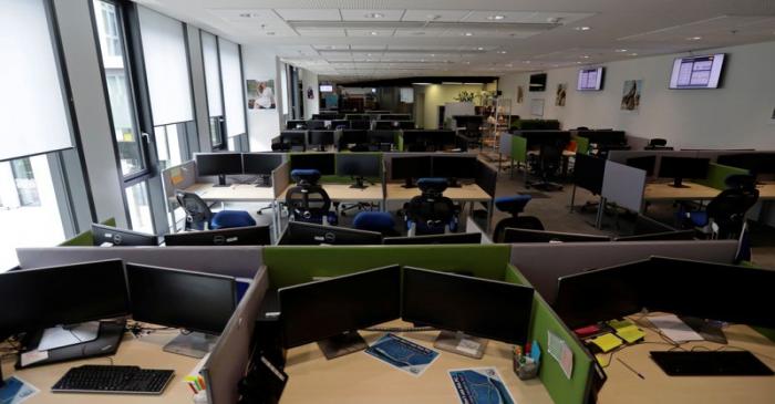 Open office workspace is seen in an empty office in Prague