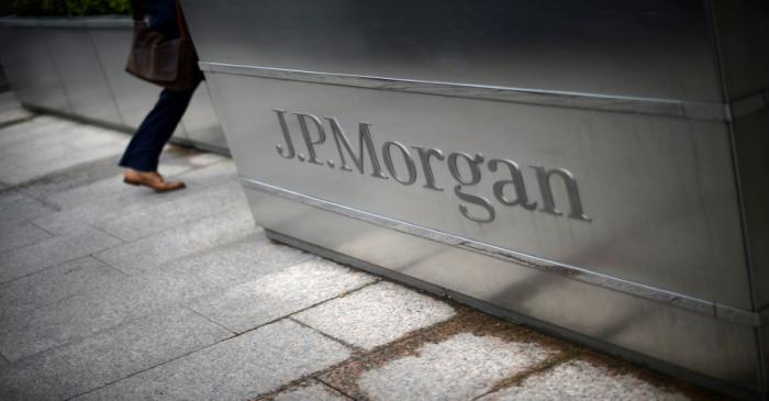 A man walks into the JP Morgan headquarters at Canary Wharf in London