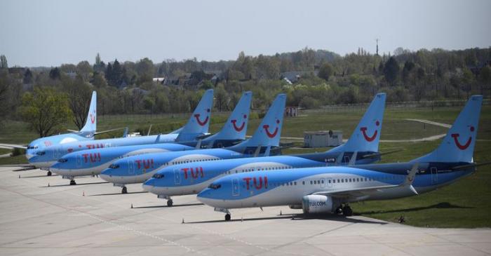 FILE PHOTO: Planes of German carrier TUI parked on a closed runway at the airport in Hanover
