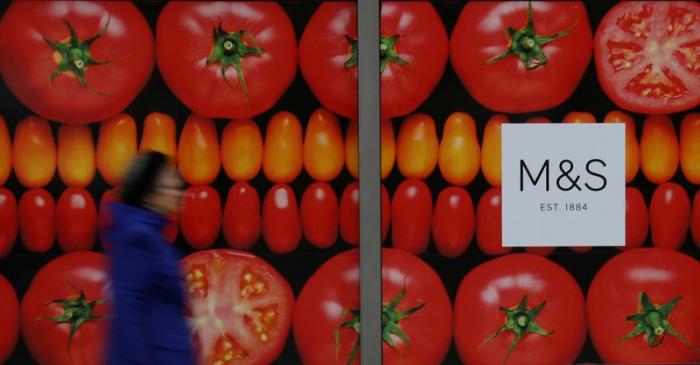 FILE PHOTO: A woman walks past a Marks & Spencer branch in Altrincham, Britain