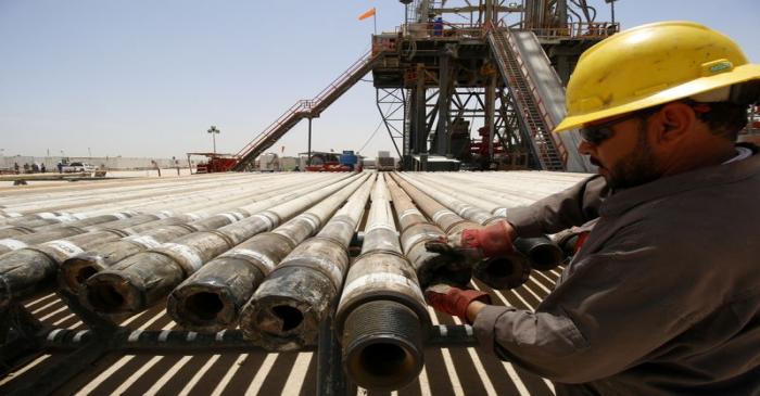 FILE PHOTO: A man works for Iraqi Drilling Company at Rumaila oilfield in Basra
